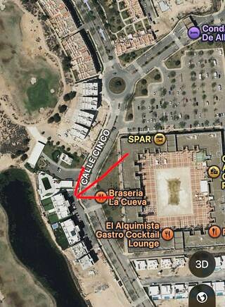 Satellite view of Condado de Alhama. A red arrow marks Mirador on Calle Cinco, beside Brasería La Cueva.